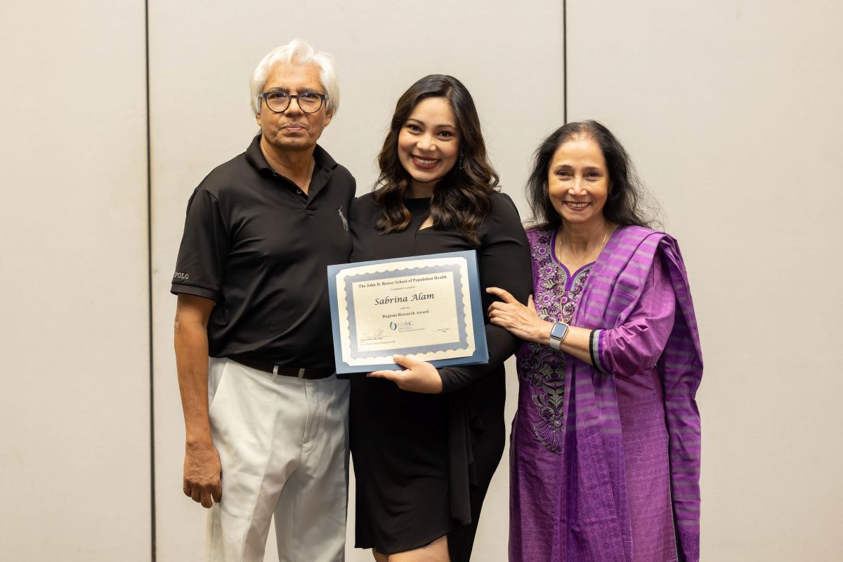 Student and parents taking a photo at the 2023 Honors and Awards Ceremony